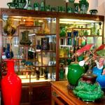 Chinese rosewood cabinets currently displaying Japanese Awaji pottery.